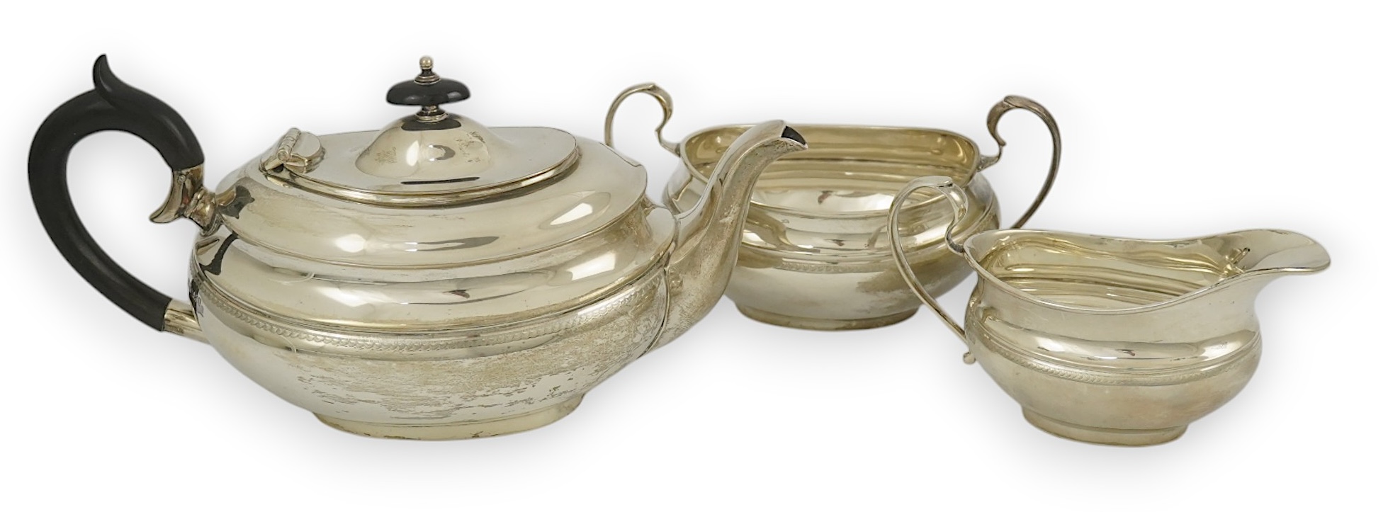 A George V silver three piece oval tea set, by Viners Ltd